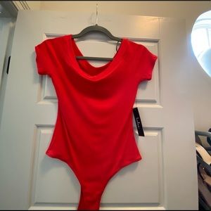 Short sleeved body suit never worn